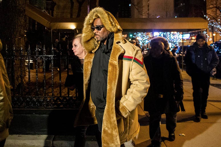 AP19057533649156 R. Kelly walks to his vehicle after exiting a cigar lounge in Chicago on Monday, Feb. 25, 2019. A suburban Chicago woman posted the $100,000 bail for R. Kelly to be freed from jail while he awaits trial on sexual abuse charges. (Tyler LaRiviere/Chicago Su