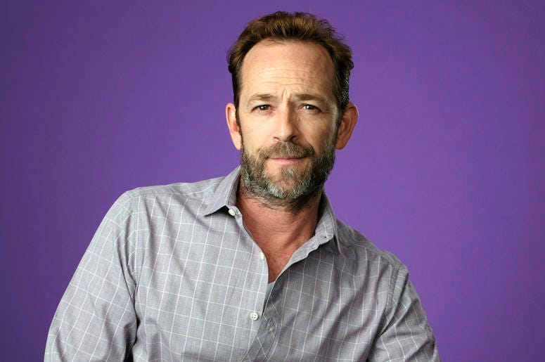 AP19059594846753 In this Aug. 6, 2018, file photo, Luke Perry, a cast member in the CW series "Riverdale," poses for a portrait during the 2018 Television Critics Association Summer Press Tour in Beverly Hills, Calif. A publicist for the "Riverdale" and "Beverly Hills, 90
