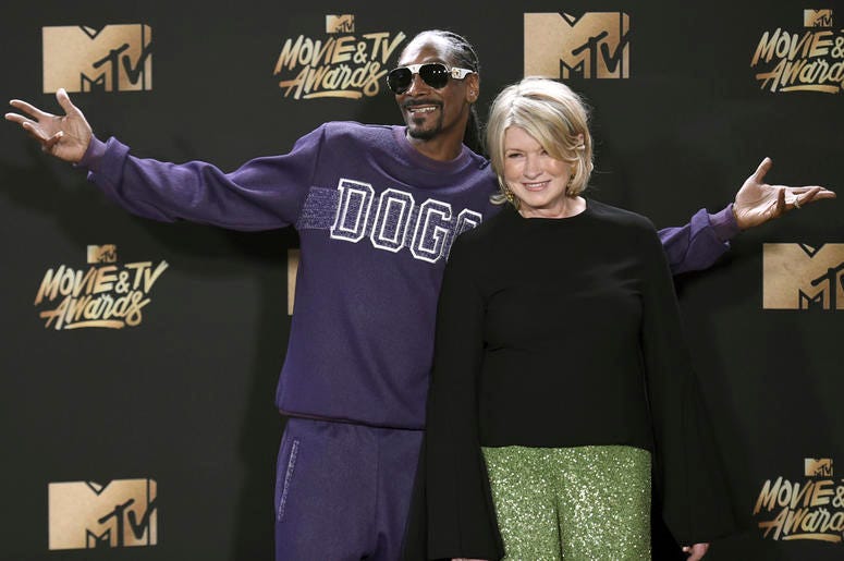 AP19059827021434 In this May 7, 2017 file photo, Snoop Dogg, left, and Martha Stewart pose in the press room at the MTV Movie and TV Awards in Los Angeles. The domestic diva who brought us hemp yarn is now partnering with Canada's Canopy Growth Corp. to develop new produc