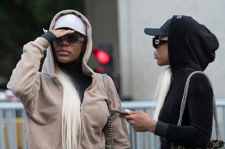AP19094812750813 This July 11, 2018 file photo shows Shannade Clermont, left, and her twin sister Shannon outside of federal court in New York after her arraignment on charges she stole debit card information from a man who died from a drug overdose in his Manhattan apart
