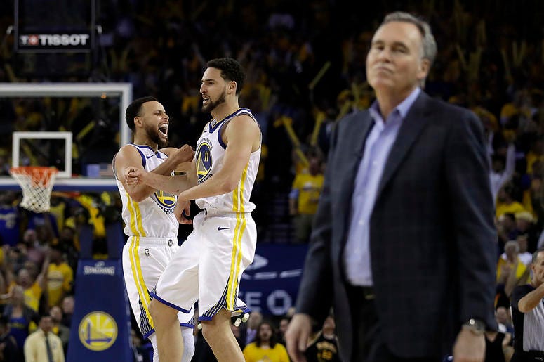 AP19129233576066 Golden State Warriors' Stephen Curry, left, and Klay Thompson celebrate as Houston Rockets coach Mike D'Antoni walks onto the court during the second half of Game 5 of a second-round NBA basketball playoff series Wednesday, May 8, 2019, in Oakland, Calif.