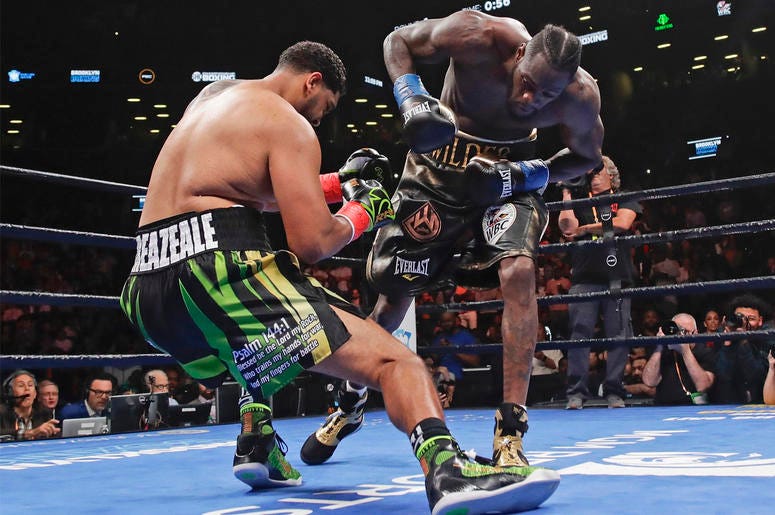 AP19139122931955 Deontay Wilder, right, knocks down Dominic Breazeale during the first round of the WBC heavyweight championship boxing match Saturday, May 18, 2019, in New York. Wilder stopped Breazeale in the first round. (AP Photo/Frank Franklin II)