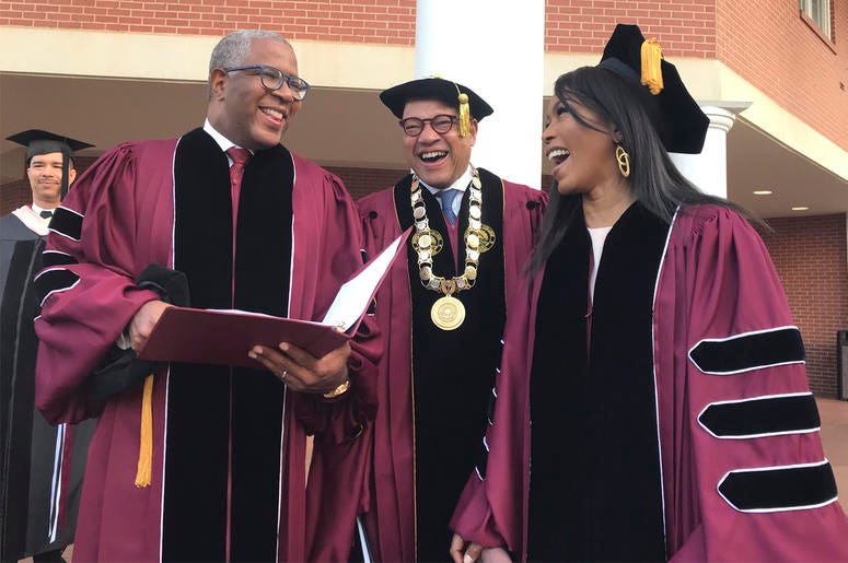 AP19139618471189 Robert F. Smith, left, laughs with David Thomas, center, and actress Angela Bassett at Morehouse College on Sunday, May 19, 2019, in Atlanta. (Bo Emerson/Atlanta Journal-Constitution via AP)