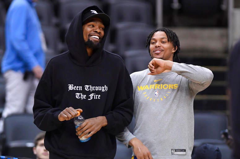 Golden State Warriors Kevin Durant laughs with teammate Damion Lee Golden State Warriors Kevin Durant laughs with teammate Damion Lee