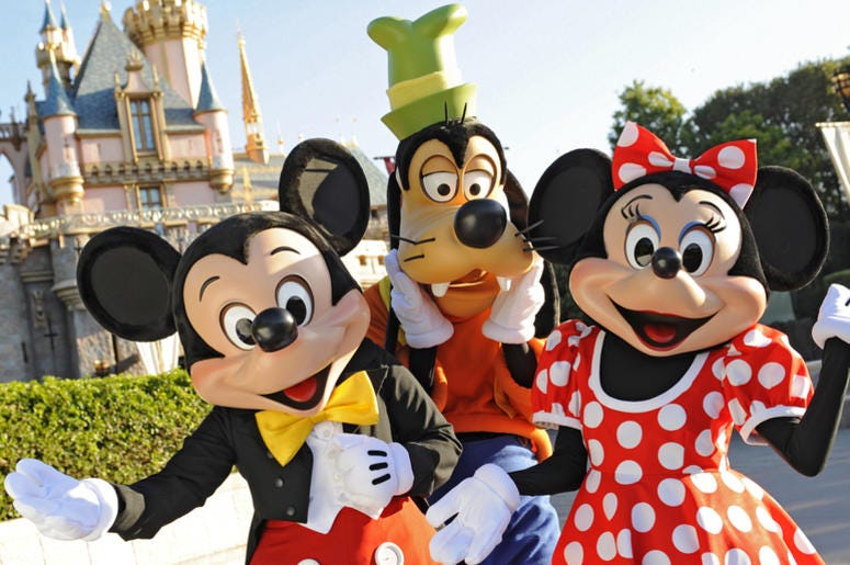 Mickey Mouse, Goofy and Minnie Mouse in front of Snow White's Castle at Disneyland - Anaheim Standing in front of Sleeping Beauty Castle at Disneyland, where magical storybooks come alive, Mickey Mouse, Goofy and Minnie Mouse welcome visitors from all over the world. Combining classic favorites and exciting additions, Disneyland park is an essent