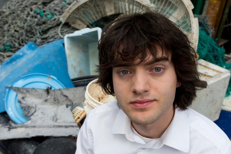 7494ac12b30640c081f6a429e234b086 In this May 11, 2017, file photo, Dutch innovator Boyan Slat poses for a portrait next to a pile of plastic garbage prior to a press conference in Utrecht, Netherlands. Engineers will deploy a trash collection device to corral plastic litter floating betw