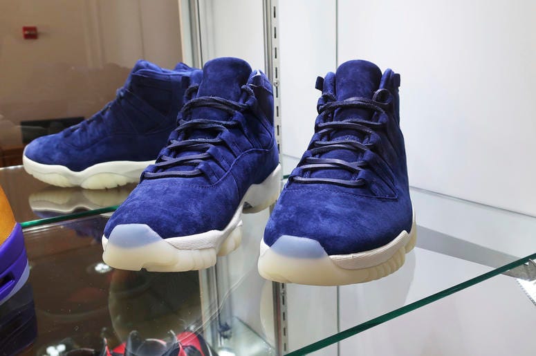 AP19193776543928 A pair of 2017 "Air Jordan 11 Jeter Derek Jeter" shoes are on display at Sotheby's auction house in New York on July 12, 2019. Sotheby's expects the shoes to auction online for $40,000 to $60,000. (AP Photo/Ted Shaffrey)