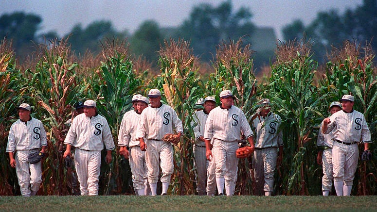 AP19220556962495 In this July 22, 1977, file photo, people portraying ghost players emerge from a cornfield as they reenact a scene from the movie "Field of Dreams" at the movie site in Dyersville, Iowa. The Chicago White Sox will play a game against the New York Yankees