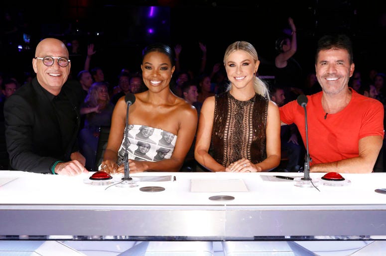 Howie Mandel, Gabrielle Union, Julianne Hough, Simon Cowell This image released by NBC shows celebrity judges, from left, Howie Mandel, Gabrielle Union, Julianne Hough, Simon Cowell on the set of "America's Got Talent," in Los Angeles. (Trae Patton/NBC via AP)