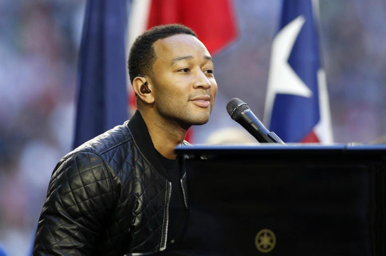 John Legend performs before Super Bowl XLIX between the New England Patriots and the Seattle Seahawks at University of Phoenix Stadium. John Legend performs before Super Bowl XLIX between the New England Patriots and the Seattle Seahawks at University of Phoenix Stadium.