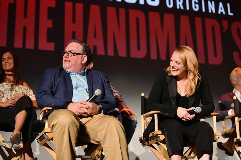 Bruce Miller and Elisabeth Moss speak onstage during "The Handmaid's Tale" Hulu finale at The Wilshire Ebell Theatre on July 9, 2018 in Los Angeles, California Bruce Miller and Elisabeth Moss speak onstage during "The Handmaid's Tale" Hulu finale at The Wilshire Ebell Theatre on July 9, 2018 in Los Angeles, California