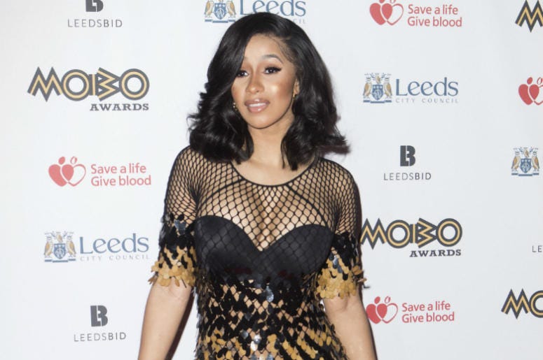 Cardi B 4/26/2018 - File photo dated 29/11/17 of Cardi B, who has reassured fans she will still be working her "ass off" despite cancelling a number of live shows due to her pregnancy.