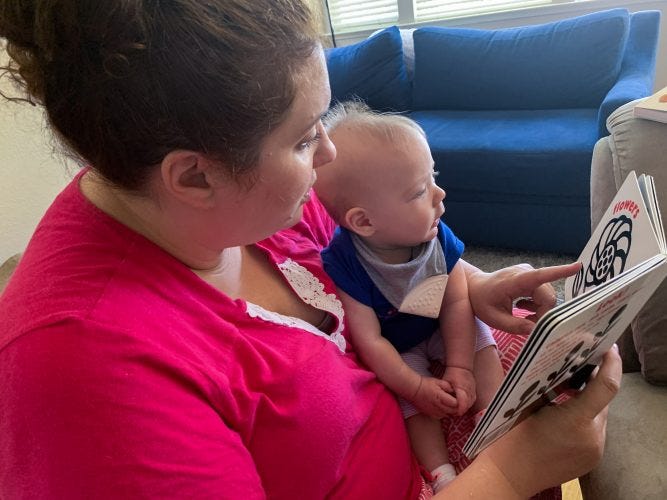 Kristen reading to Lilly