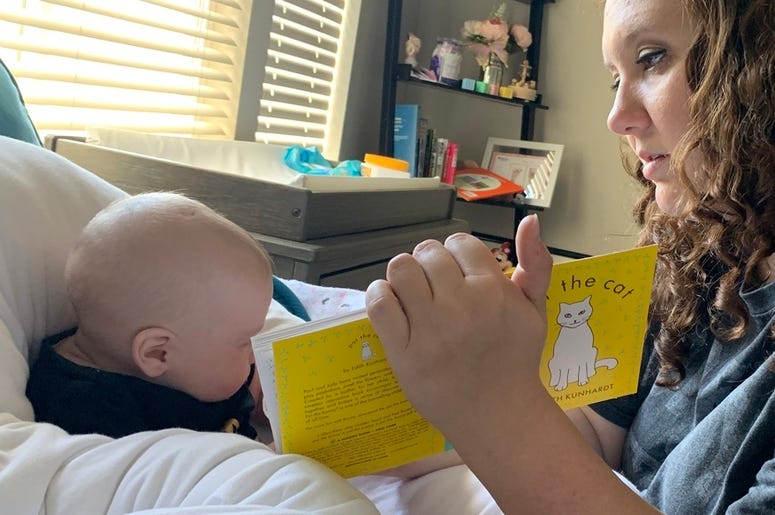 Kristen reading to Lilly