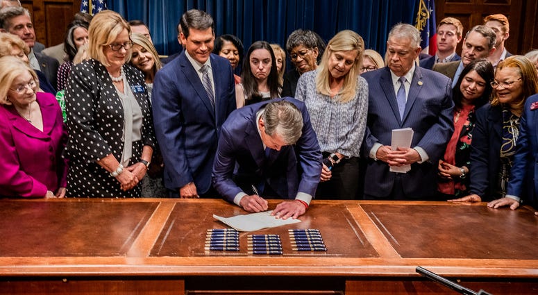 Georgia Governor Brian Kemp signs bill banning abortions after 6 weeks. Georgia Governor Brian Kemp signs bill banning abortions after 6 weeks.