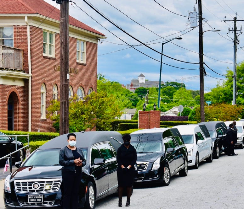 Funeral procession prepares to leave funeral home in southwest Atlanta to protest the reopening of Georgia during the COVID-19 pandemic Funeral procession prepares to leave funeral home in southwest Atlanta to protest the reopening of Georgia during the COVID-19 pandemic