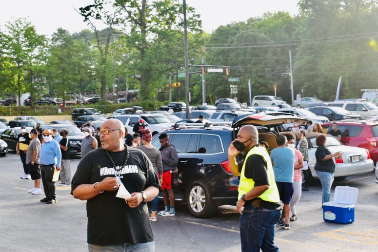 WAOK show host Derrick Boazman is among participants gathered for the caravan to Brunswick, GA