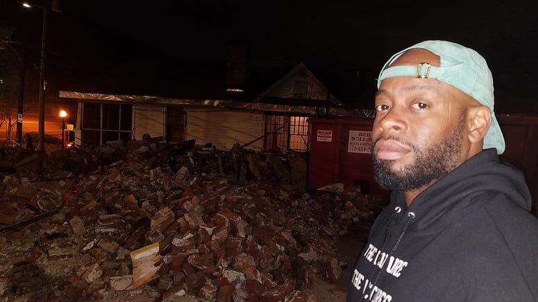 Muralist Fabian Williams looks at the remains of the building that featured his Kaepernick mural Muralist Fabian Williams looks at the remains of the building that featured his Kaepernick mural
