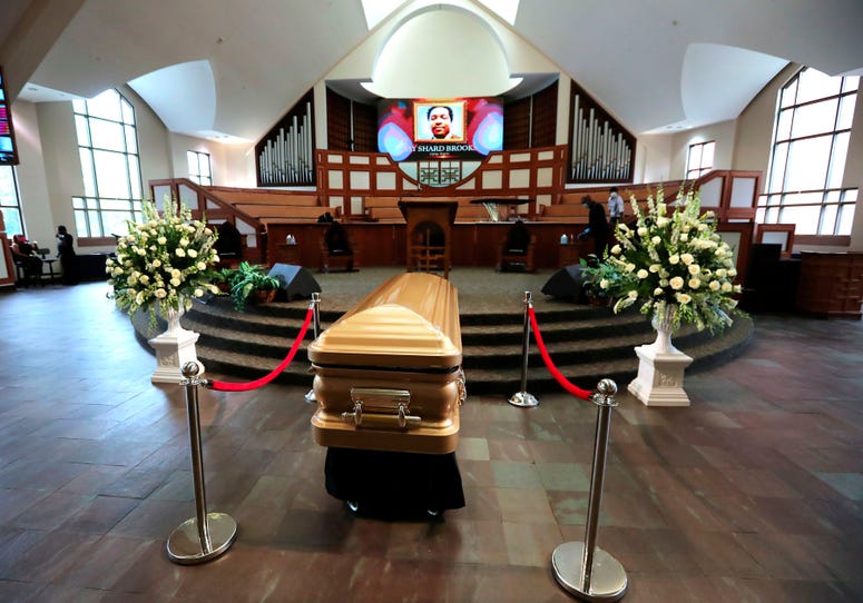 Rayshard Brooks was laid to rest in a gold casket Rayshard Brooks was laid to rest in a gold casket