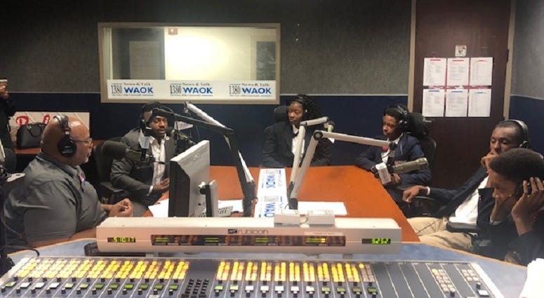 Derrick Boazman with Harvard Diversity Project Debate Team inside the WAOK Studio in Atlanta, Ga 7/17/19 Derrick Boazman with Harvard Diversity Project Debate Team