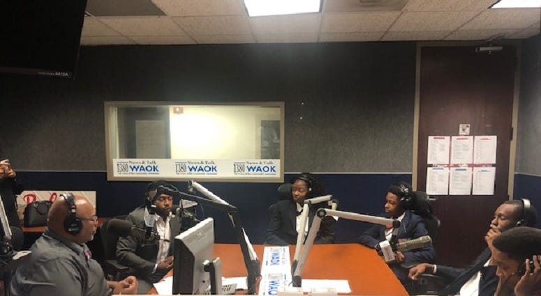 Derrick Boazman with Harvard Diversity Project Debate Team inside the WAOK Studio in Atlanta, Ga 7/17/19 Derrick Boazman with Harvard Diversity Project Debate Team