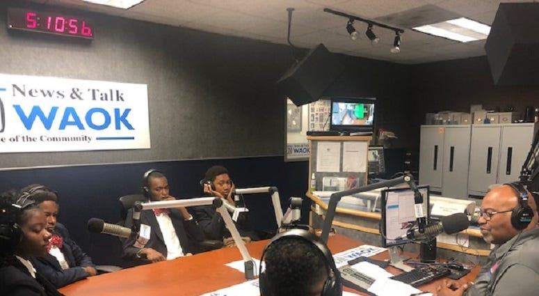 Derrick Boazman with Harvard Diversity Project Debate Team inside the WAOK Studio in Atlanta, Ga 7/17/19 Derrick Boazman with Harvard Diversity Project Debate Team