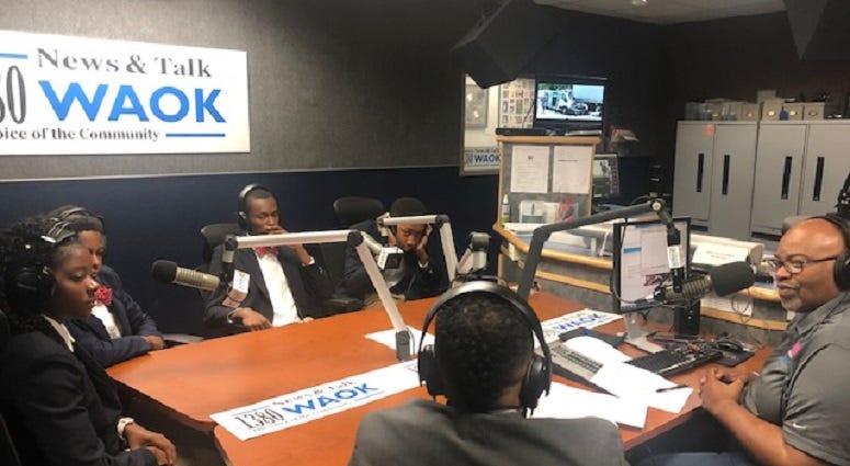Derrick Boazman with Harvard Diversity Project Debate Team inside the WAOK Studio in Atlanta, Ga 7/17/19 Derrick Boazman with Harvard Diversity Project Debate Team