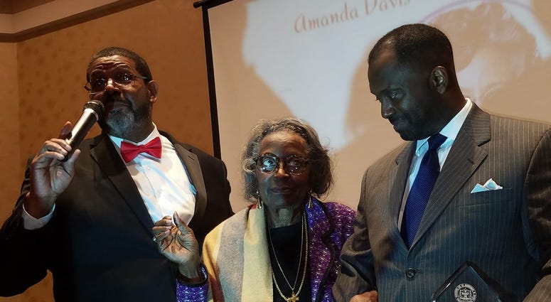 Mrs. Juanita Abernathy is flanked by Fulton County Commissioner Michael Lankford and her son Kwame Abernathy during a recent awards ceremony Mrs. Juanita Abernathy is flanked by Fulton County Commissioner Michael Lankford and her son Kwame Abernathy during a recent awards ceremony