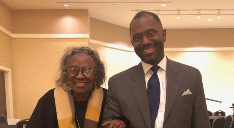 Mrs. Juanita Abernathy is escorted by her son Kwame during a Black History program in February 2019 Mrs. Juanita Abernathy is escorted by her son Kwame during a Black History program in February 2019