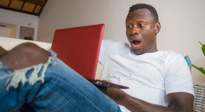 Surprised man at computer Surprised man at computer