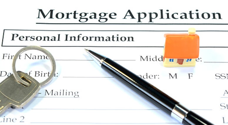 Getty Images filling out Mortgage App. Getty Images filling out Mortgage App.
