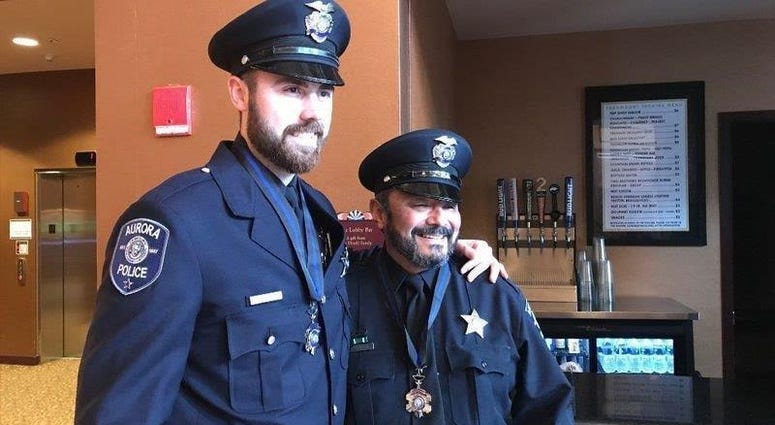 Two Aurora police officers have returned to full duty nearly nine months after being wounded in a mass shooting at the Henry Pratt Company. Two Aurora police officers have returned to full duty nearly nine months after being wounded in a mass shooting at the Henry Pratt Company.