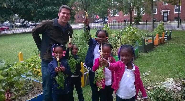 Adam Zmick, with students apart of the Gardeneers program