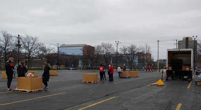 Volunteers collected personal protective equipment for those on the front lines of the coronavirus epidemic during a drive outside the United Center this afternoon.