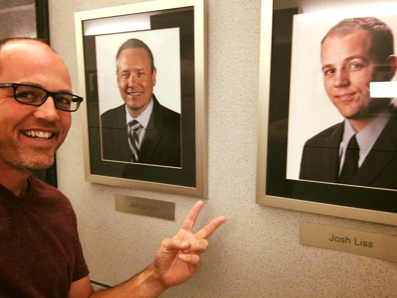 Josh Liss posed with Jeff Joniak and his headshots in WBBM Newsradio hallway