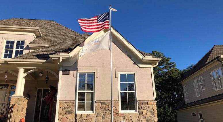 A woman whose son was killed in the Feb. 15 Aurora warehouse shooting was ordered by her homeowners’ association to remove an Aurora Strong flag from a pole outside her North Carolina home A woman whose son was killed in the Feb. 15 Aurora warehouse shooting was ordered by her homeowners’ association to remove an Aurora Strong flag from a pole outside her North Carolina home