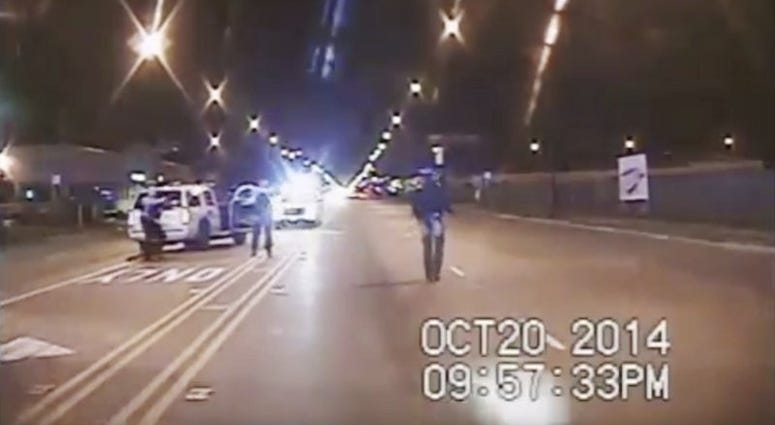 Image taken from dash-cam video provided by the Chicago Police Department, Laquan McDonald, right, walks down the street moments before being fatally shot by Chicago police officer Jason Van Dyke in Chicago.