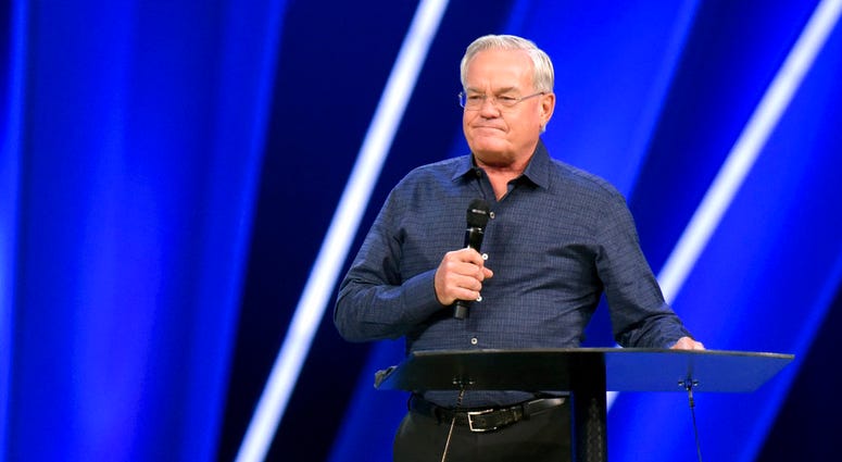 Willow Creek Community Church Senior Pastor Bill Hybels stands before his congregation, Tuesday, April 10, 2018, in South Barrington, Ill., where he announced his early retirement effective immediately.