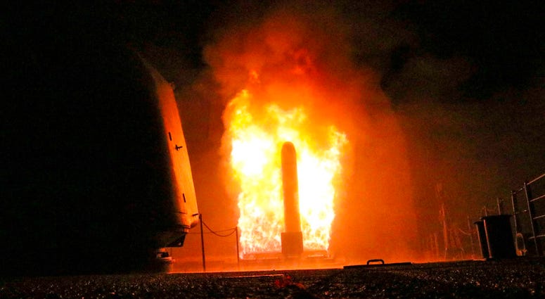 the guided-missile cruiser USS Monterey (CG 61) fires a Tomahawk land attack missile early Saturday, April 14, 2018 In this image provided by the U.S. Navy, the guided-missile cruiser USS Monterey (CG 61) fires a Tomahawk land attack missile early Saturday, April 14, 2018, as part of the military response to Syria's use of chemical weapons on April 7. The United States