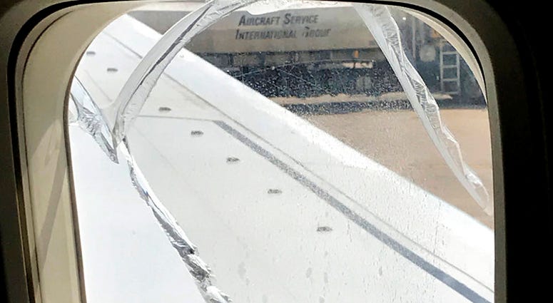 A crack is seen on a window of Southwest Airlines Flight 957 after an abrupt landing in Cleveland, Wednesday, May 2, 2018. The cracked window forced the Chicago to Newark, N.J., Flight 957 to land in Cleveland on Wednesday.