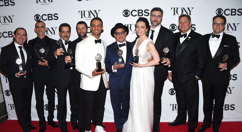 Cast and crew of "The Band's Visit" pose in the press room with the award for best musical at the 72nd annual Tony Awards at Radio City Music Hall on Sunday, June 10, 2018, in New York.