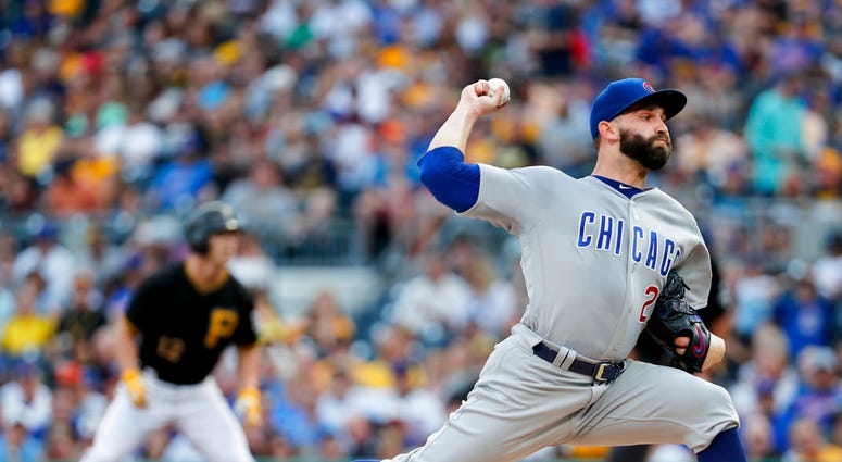 Chicago Cubs starter Tyler Chatwood, right, pitches as Pittsburgh Pirates' Corey Dickerson, left, leads off first during the first inning of a baseball game Saturday, Aug. 18, 2018, in Pittsburgh. (AP Photo/Keith Srakocic) Chicago Cubs starter Tyler Chatwood, right, pitches as Pittsburgh Pirates' Corey Dickerson, left, leads off first during the first inning of a baseball game Saturday, Aug. 18, 2018, in Pittsburgh. (AP Photo/Keith Srakocic)