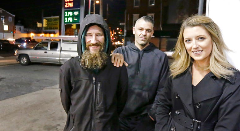 Johnny Bobbitt Jr., left, Kate McClure, right, and McClure's boyfriend Mark D'Amico