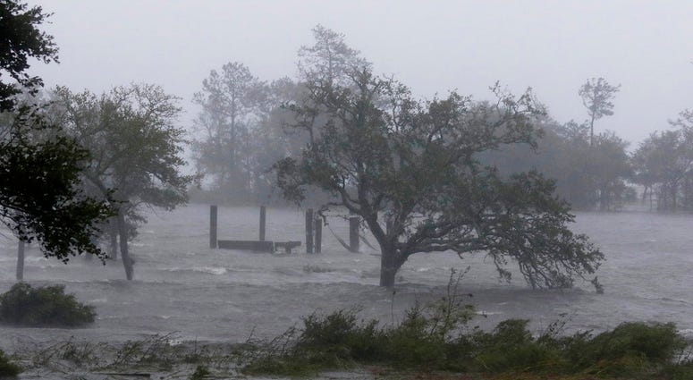 High winds and storm surge from Hurricane Florence hits Swansboro N.C., Friday, Sept. 14, 2018. (AP Photo/Tom Copeland) High winds and storm surge from Hurricane Florence hits Swansboro N.C., Friday, Sept. 14, 2018. (AP Photo/Tom Copeland)