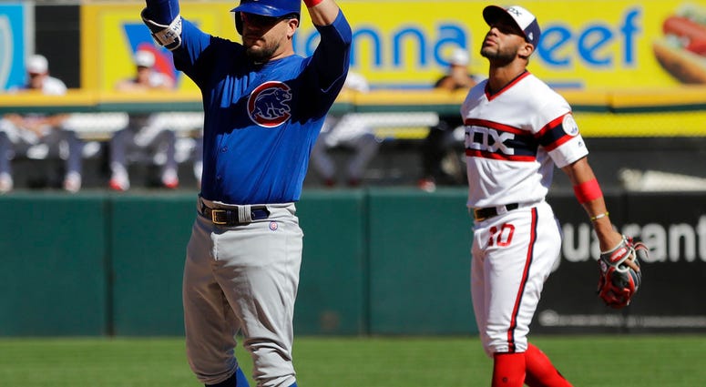 Chicago Cubs' Kyle Schwarber, left, celebrates after hitting a one-run double as Chicago White Sox second baseman Yoan Moncada reacts during the third inning of a baseball game, Sunday, Sept. 23, 2018, in Chicago. (AP Photo/Nam Y. Huh) Chicago Cubs' Kyle Schwarber, left, celebrates after hitting a one-run double as Chicago White Sox second baseman Yoan Moncada reacts during the third inning of a baseball game, Sunday, Sept. 23, 2018, in Chicago. (AP Photo/Nam Y. Huh)