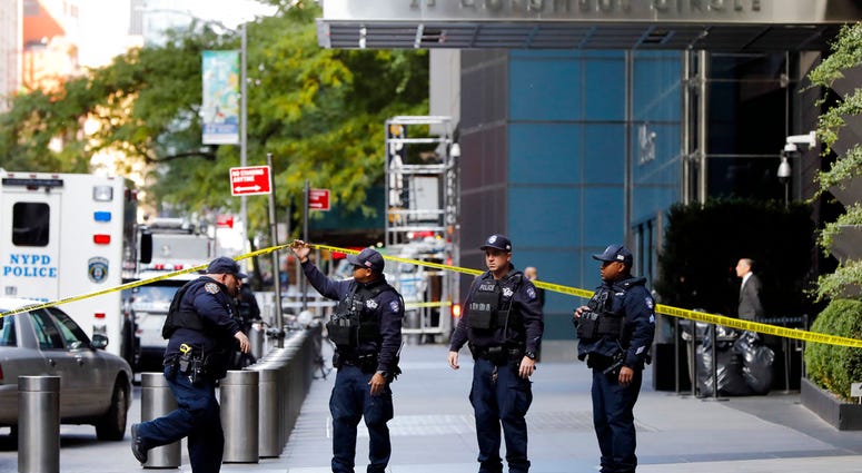 New York City Police Dept. officers arrive outside the Time Warner Center, in New York, Wednesday, Oct. 24, 2018. A police bomb squad was sent to CNN's offices in New York City and the newsroom was evacuated because of a suspicious package.