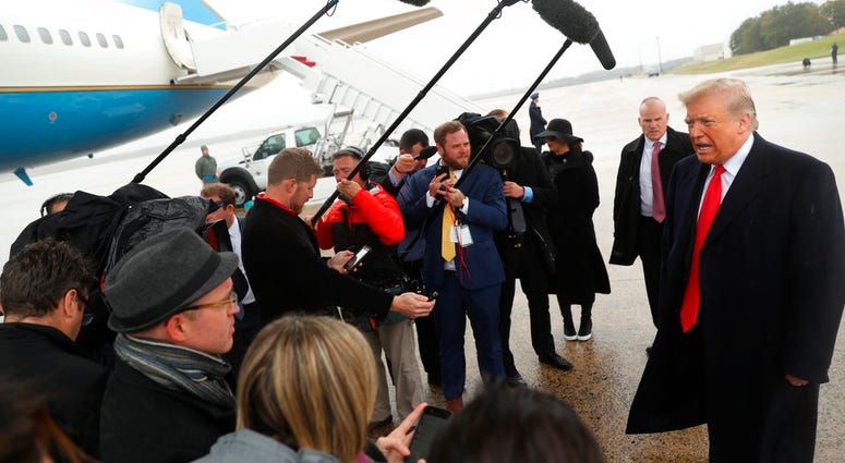 President Donald Trump speaks to the media at Air Force One at Andrews Air Force Base, Saturday, Oct. 27, 2018, before travelling to Indianapolis to speak at the 91st Annual Future Farmers of America Convention and Expo. (AP Photo/Andrew Harnik) President Donald Trump speaks to the media at Air Force One at Andrews Air Force Base, Saturday, Oct. 27, 2018, before travelling to Indianapolis to speak at the 91st Annual Future Farmers of America Convention and Expo. (AP Photo/Andrew Harnik)