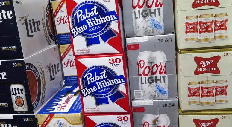 Pabst Blue Ribbon and Coors Light are stacked next to each other in a Milwaukee liquor store.