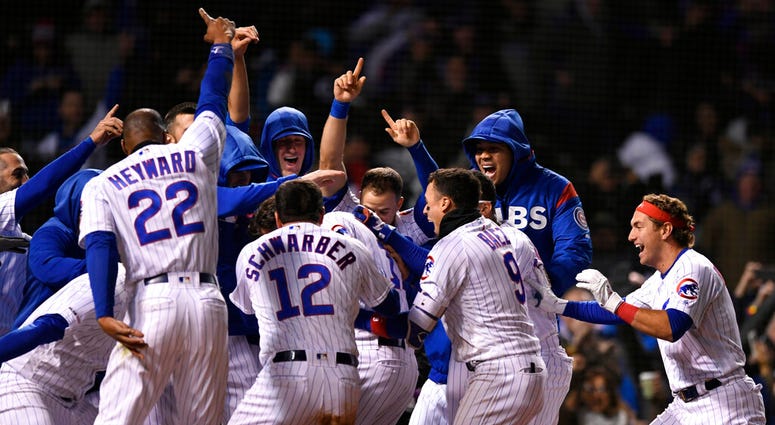 Chicago Cubs players celebrate after Kris Bryant hit a walk-off, three-run home run during the ninth inning of a baseball game to defeat the Miami Marlins 5-2, Tuesday, May 7, 2019, in Chicago. Chicago Cubs players celebrate after Kris Bryant hit a walk-off, three-run home run during the ninth inning of a baseball game to defeat the Miami Marlins 5-2, Tuesday, May 7, 2019, in Chicago.