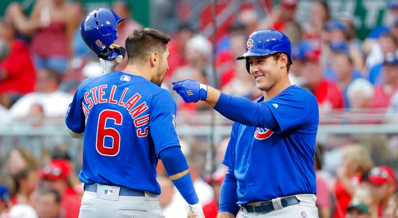 Chicago Cubs' Nicholas Castellanos (6) celebrates with Anthony Rizzo, right, after hitting a solo home run off Cincinnati Reds starting pitcher Alex Wood during the third inning of a baseball game Thursday, Aug. 8, 2019, in Cincinnati. Chicago Cubs' Nicholas Castellanos (6) celebrates with Anthony Rizzo, right, after hitting a solo home run off Cincinnati Reds starting pitcher Alex Wood during the third inning of a baseball game Thursday, Aug. 8, 2019, in Cincinnati.